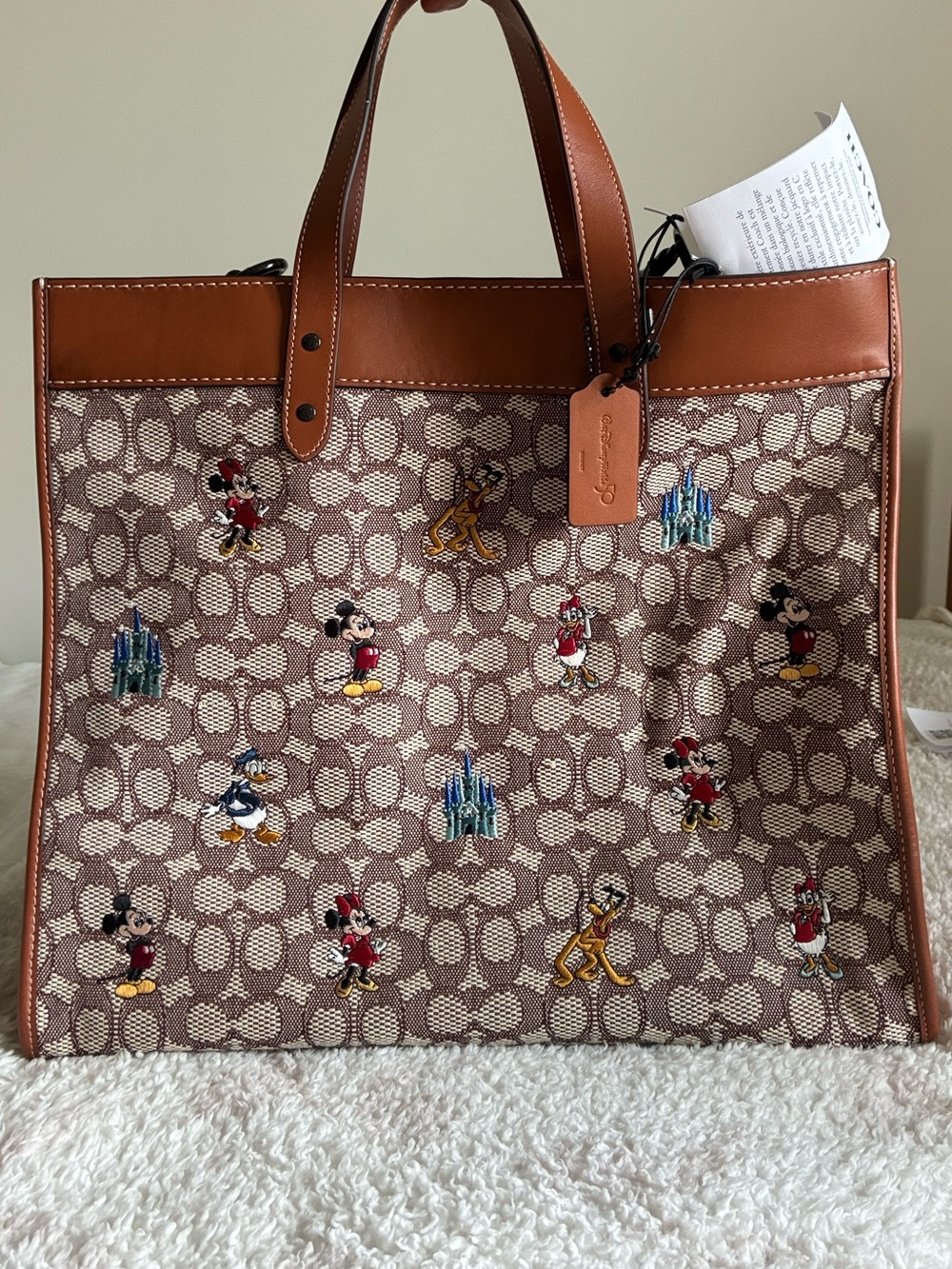 Coach X Disney Brown Signature Canvas Tote with Red & Yellow Shoulder Strap